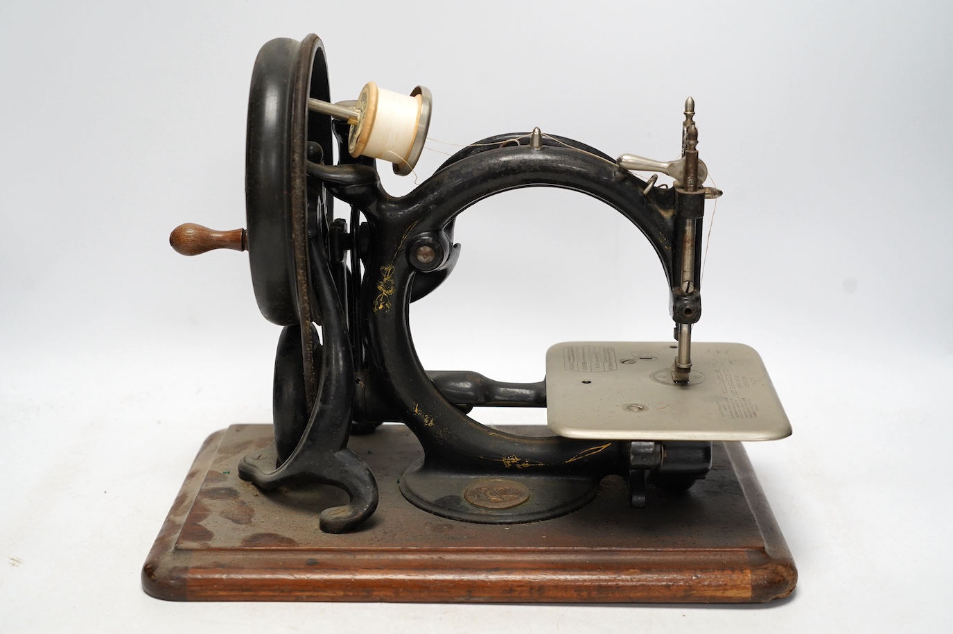 A late 19th/early 20th century Willcox & Gibbs swan neck sewing machine, with its original mahogany case, engraved brass owners label to top of case. Condition - fair to good